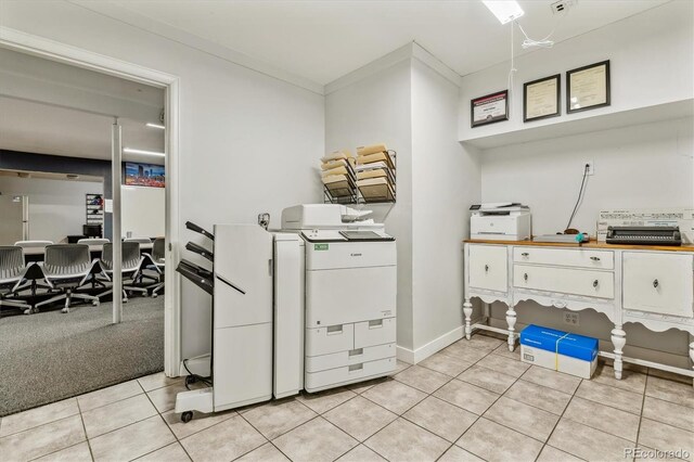1050 S Quitman St, Denver, CO 80219 - laundry room with baseboards, ornamental molding, and light tile patterned floors