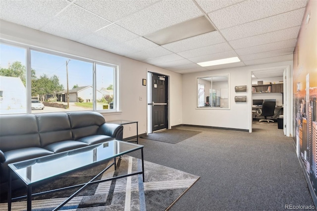 1050 S Quitman St, Denver, CO 80219 - living area featuring a drop ceiling, a desk, carpet floors, and healthy amount of natural light