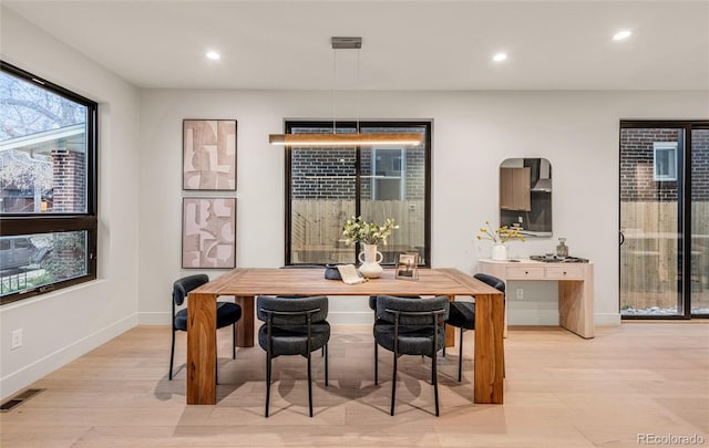 dining space featuring light hardwood / wood-style floors