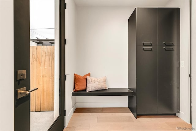 mudroom with light hardwood / wood-style flooring