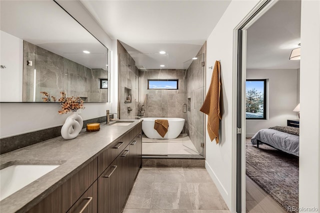 bathroom with tile patterned flooring, vanity, and plus walk in shower