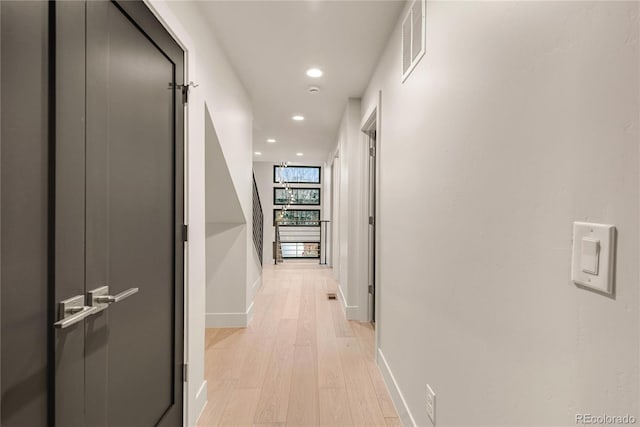 corridor featuring light hardwood / wood-style floors