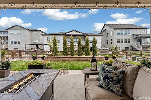 228 Rogers Ct, Castle Rock, CO 80104 - view of patio featuring a residential view and an outdoor living space with a fire pit