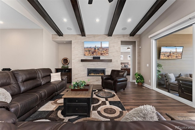 228 Rogers Ct, Castle Rock, CO 80104 - living room featuring wood finished floors, beamed ceiling, a large fireplace, ceiling fan, and recessed lighting