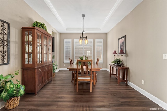 228 Rogers Ct, Castle Rock, CO 80104 - dining space featuring a chandelier, a raised ceiling, dark wood finished floors, and baseboards
