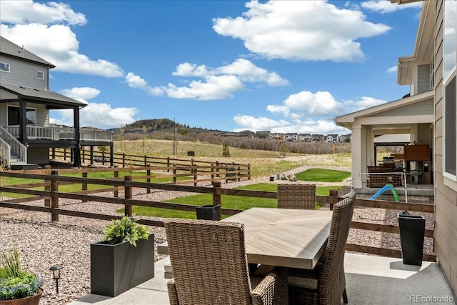 228 Rogers Ct, Castle Rock, CO 80104 - view of patio featuring a mountain view and outdoor dining area
