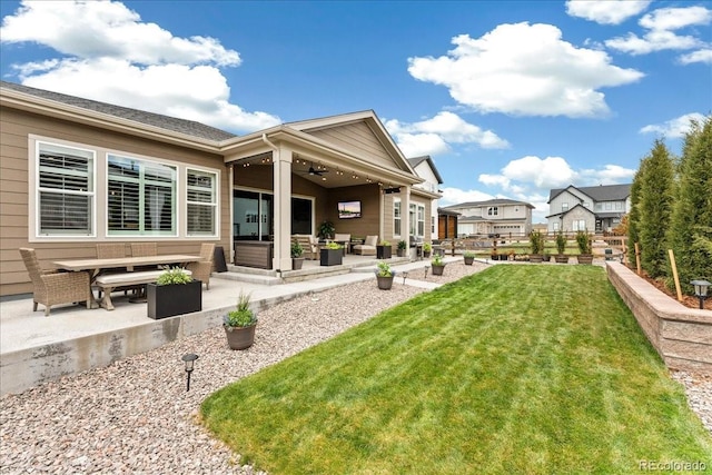 228 Rogers Ct, Castle Rock, CO 80104 - rear view of house with a patio area, a yard, an outdoor hangout area, and a ceiling fan