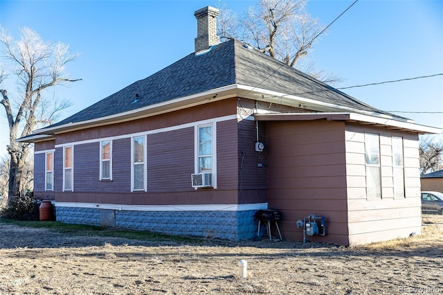 view of side of property with cooling unit