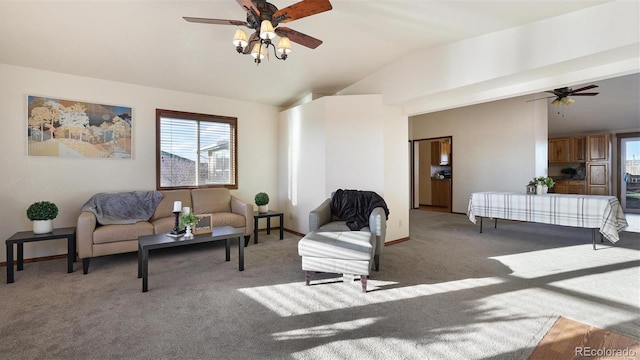 living room with vaulted ceiling, ceiling fan, and carpet