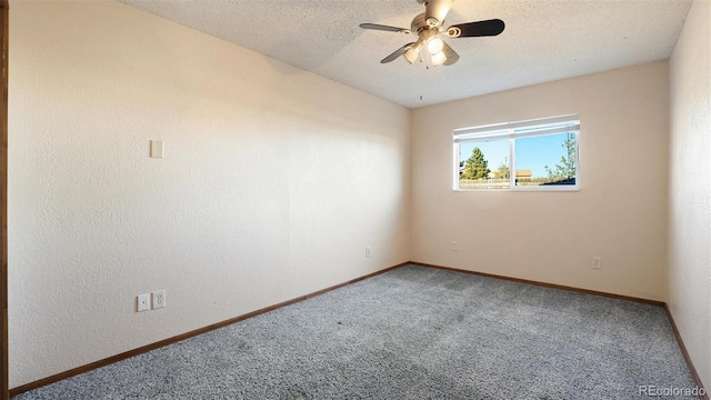 unfurnished room featuring ceiling fan, carpet floors, and a textured ceiling