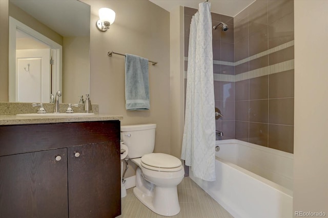 full bathroom featuring tile patterned floors, shower / bath combo with shower curtain, vanity, and toilet