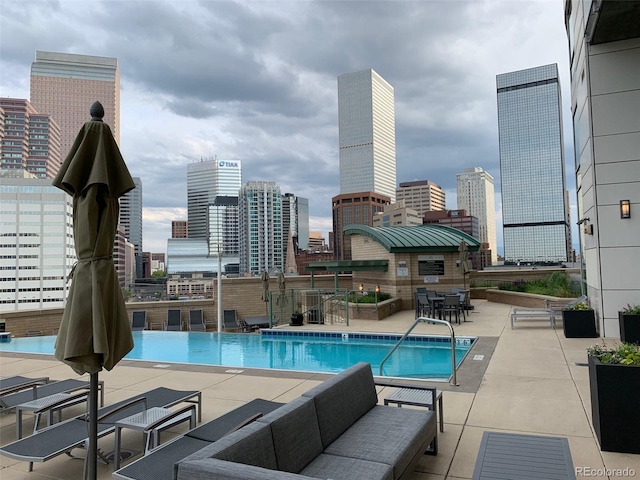 view of swimming pool featuring a patio area and an outdoor living space