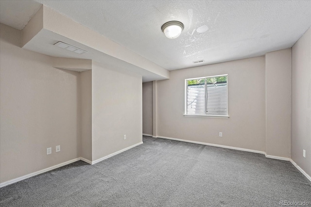 5932 S Versailles St, Aurora, CO 80015 - carpeted spare room with a textured ceiling and baseboards