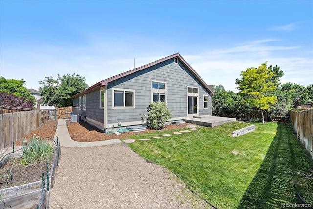 5932 S Versailles St, Aurora, CO 80015 - rear view of house with a patio area and a fenced backyard