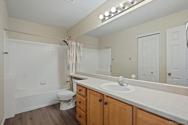 5932 S Versailles St, Aurora, CO 80015 - full bathroom featuring wood finished floors, shower / bath combo with shower curtain, and vanity