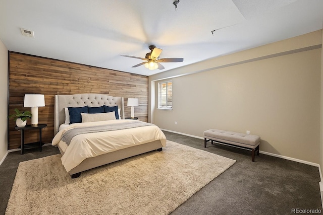 5932 S Versailles St, Aurora, CO 80015 - bedroom featuring wooden walls, carpet flooring, and ceiling fan