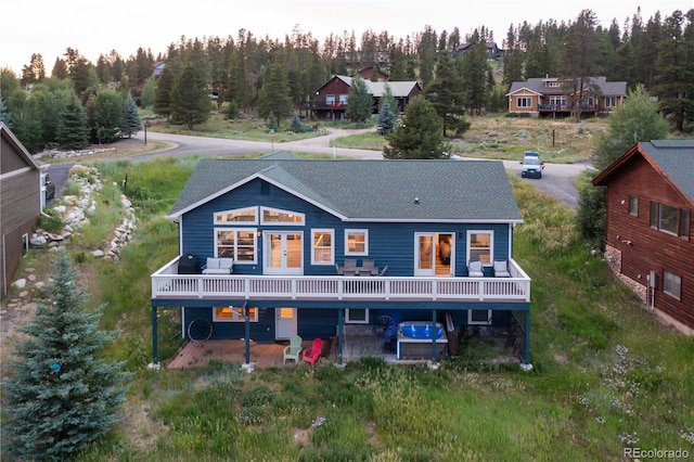 1624 Gcr 5221, Tabernash, CO 80478 - back of house with a deck and a wooded view