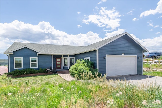 1624 Gcr 5221, Tabernash, CO 80478 - single story home with an attached garage, driveway, and roof with shingles