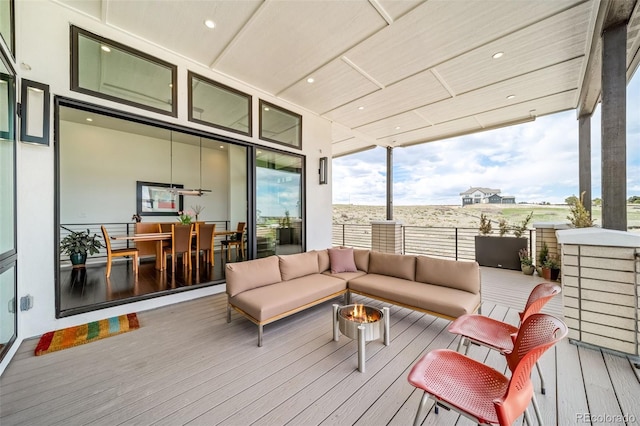 8765 Canyon Wind St, Parker, CO 80138 - wooden terrace featuring an outdoor living space with a fire pit