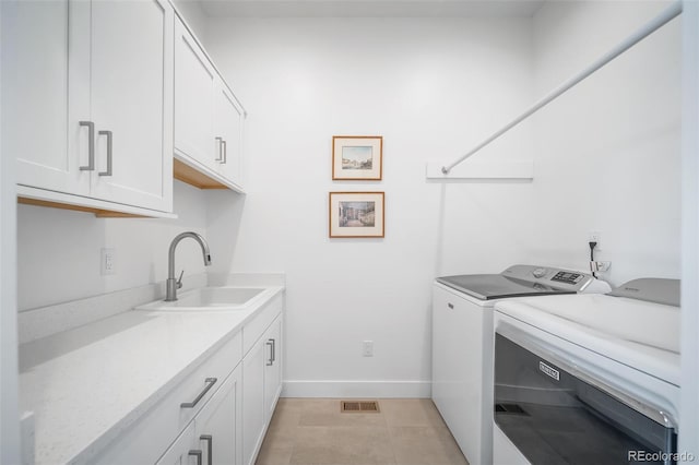 8765 Canyon Wind St, Parker, CO 80138 - laundry area featuring independent washer and dryer and cabinet space