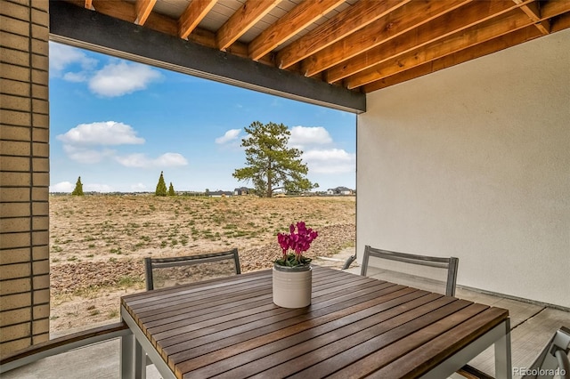 8765 Canyon Wind St, Parker, CO 80138 - view of patio featuring outdoor dining space and a view of rural / pastoral area