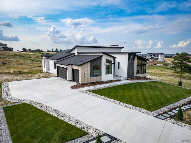 8765 Canyon Wind St, Parker, CO 80138 - view of front of home with a garage, a front yard, and concrete driveway