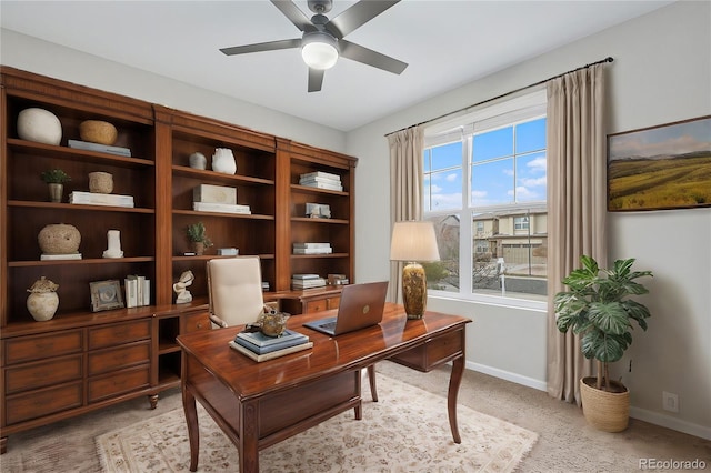 carpeted office with ceiling fan