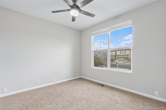 carpeted empty room with ceiling fan