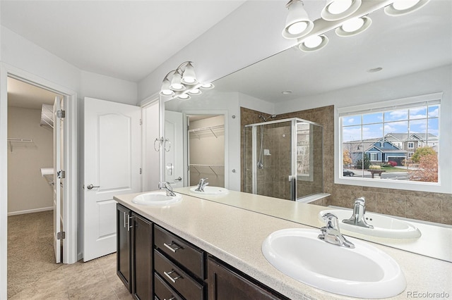 bathroom with vanity, tile patterned flooring, and a shower with shower door