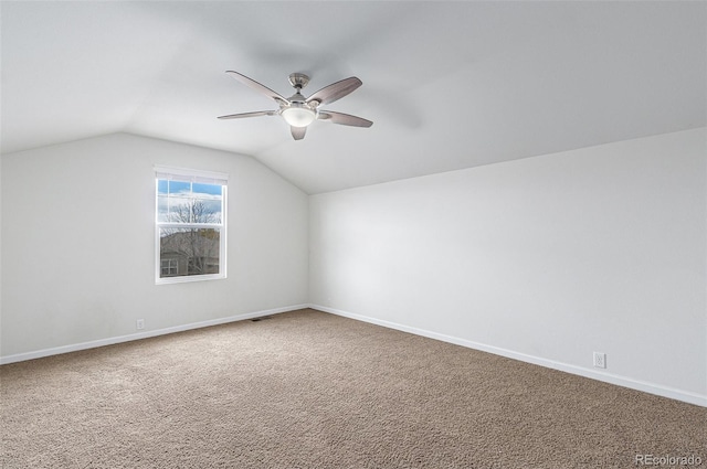 additional living space featuring carpet, ceiling fan, and vaulted ceiling