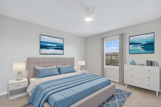 bedroom with light colored carpet and ceiling fan