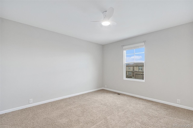 carpeted empty room with ceiling fan