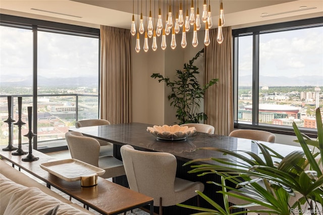 1133 14th St Unit 2000, Denver, CO 80202 - dining space featuring healthy amount of natural light and a mountain view