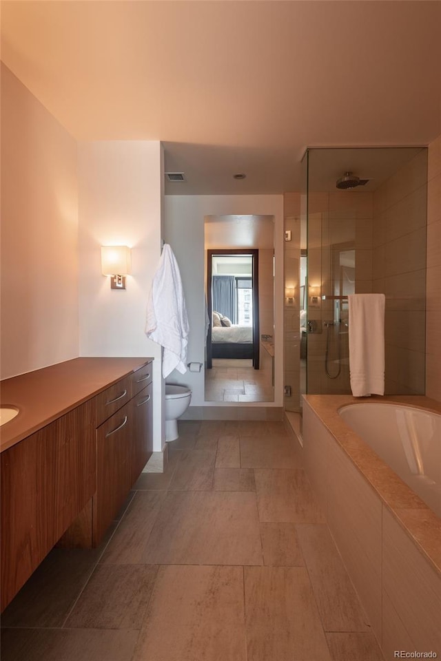 1133 14th St Unit 2000, Denver, CO 80202 - ensuite bathroom featuring a tile shower, a garden tub, toilet, and vanity