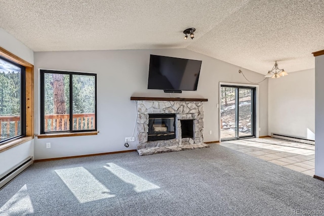 unfurnished living room with a baseboard heating unit, a stone fireplace, carpet flooring, and vaulted ceiling