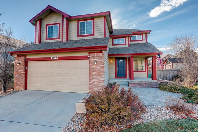 view of front of house with a porch and a garage