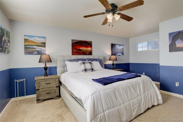 bedroom featuring ceiling fan and light colored carpet