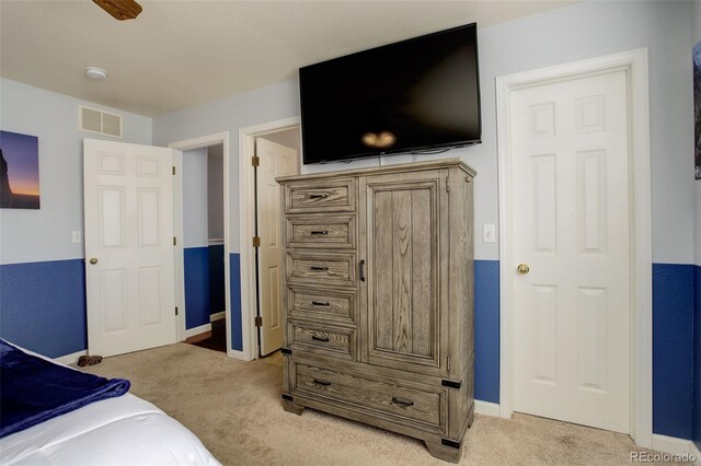 carpeted bedroom featuring ceiling fan