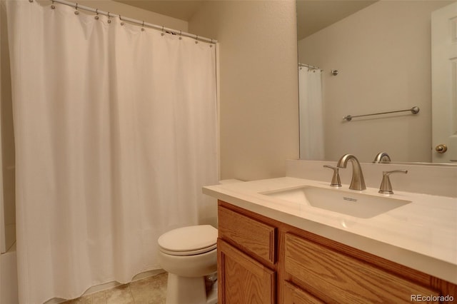 bathroom featuring tile patterned flooring, vanity, and toilet