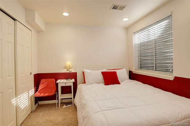 carpeted bedroom featuring a closet