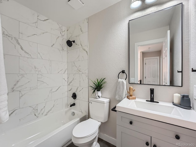 full bathroom with tiled shower / bath combo, toilet, and vanity