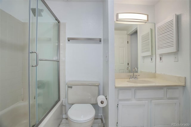 full bathroom featuring toilet, shower / bath combination with glass door, and vanity