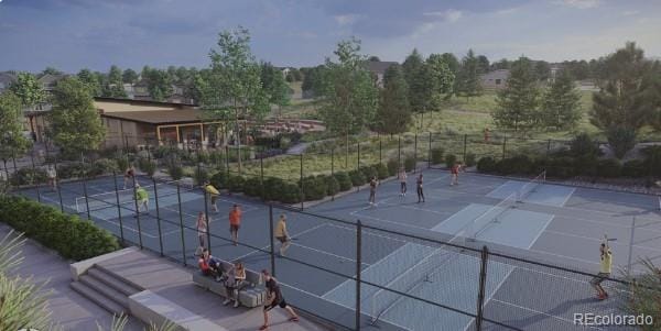 view of tennis court featuring fence
