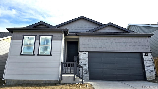 view of front of home with concrete driveway and a garage