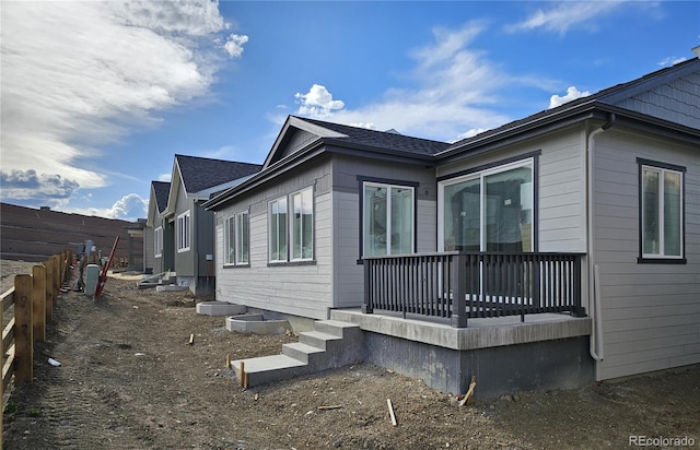view of property exterior with fence