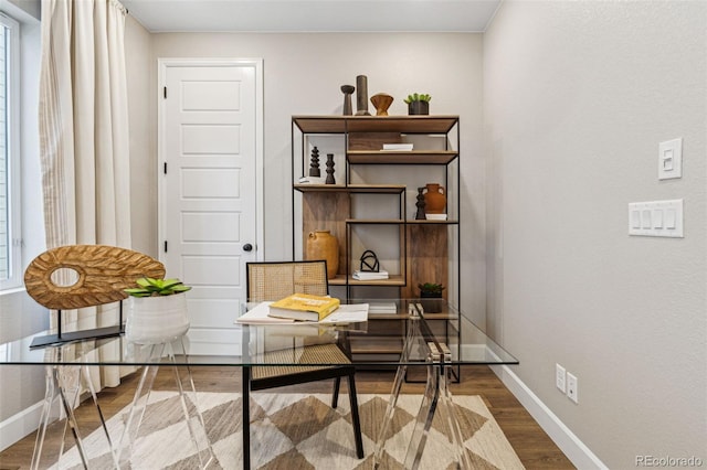 office featuring baseboards and wood finished floors