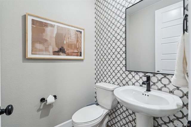 bathroom featuring a sink and toilet