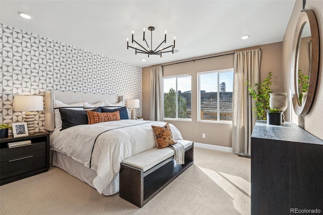 bedroom featuring baseboards, light carpet, recessed lighting, and an accent wall