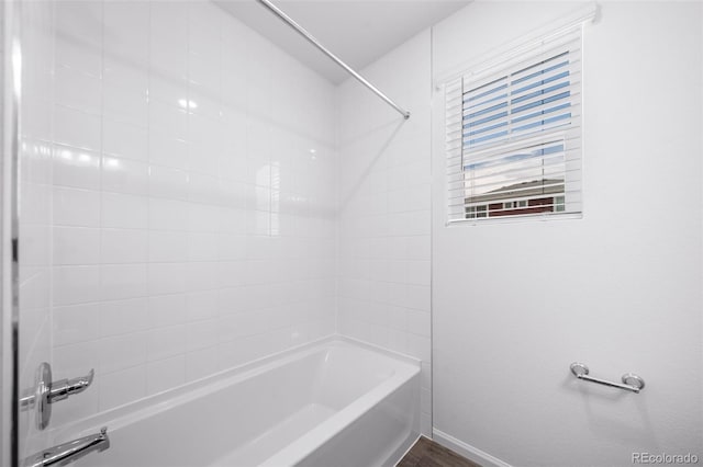 1175 Highview Dr, Erie, CO 80516 - bathroom featuring tub / shower combination, baseboards, and wood finished floors
