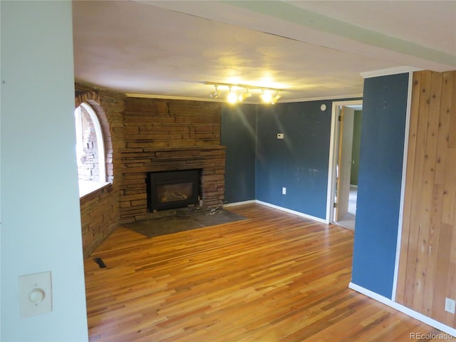 135 E 2nd St, Nederland, CO 80466 - unfurnished living room with wood finished floors and a fireplace